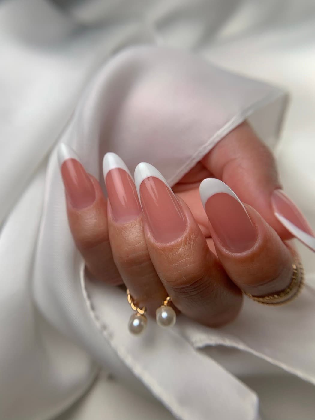 Long almond nails with a white French tip